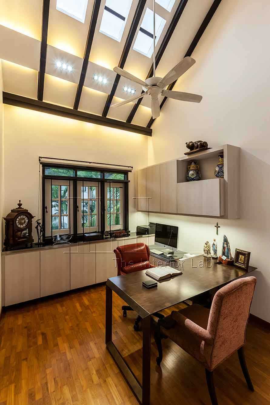 Contemporary Home Office with Bookshelf and Desk Chairs