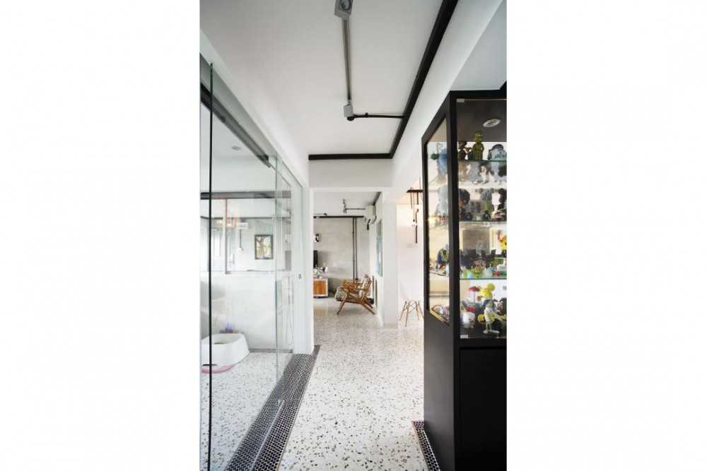 Eclectic Hallway with Display Cabinets and Room Divider