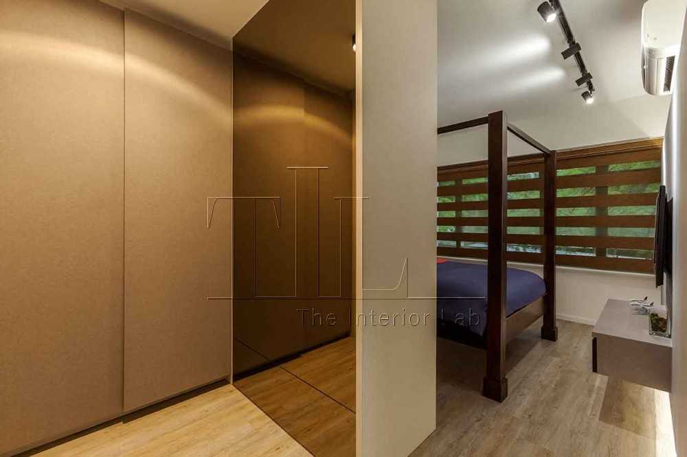 Eclectic Walk-in Wardrobe with Wood Flooring and Mirror