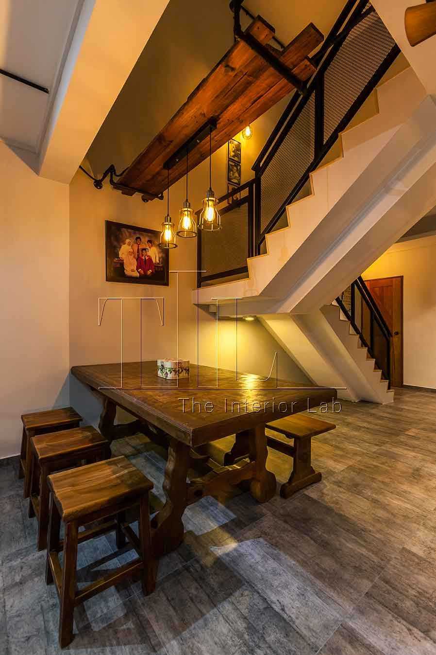 Industrial Dining Room with Drop Light and Staircase