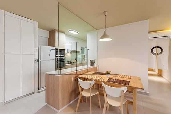 Minimalist Dining Room with Drop Light and Open Kitchen
