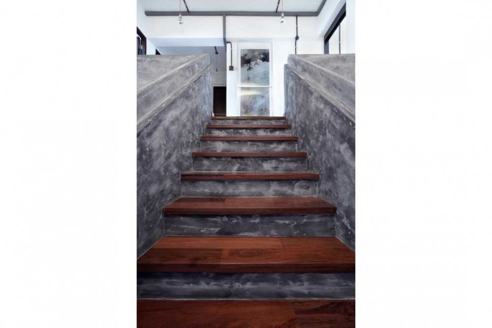 Industrial Hallway with Cement Floor and Wood Flooring