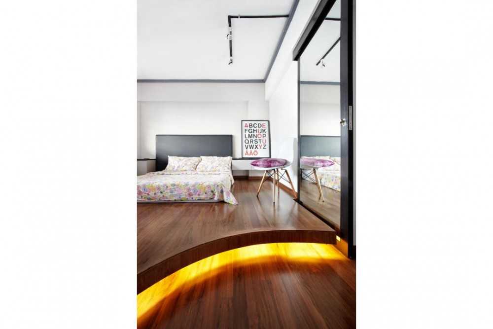 Industrial Bedroom with Wood Flooring and Side Table