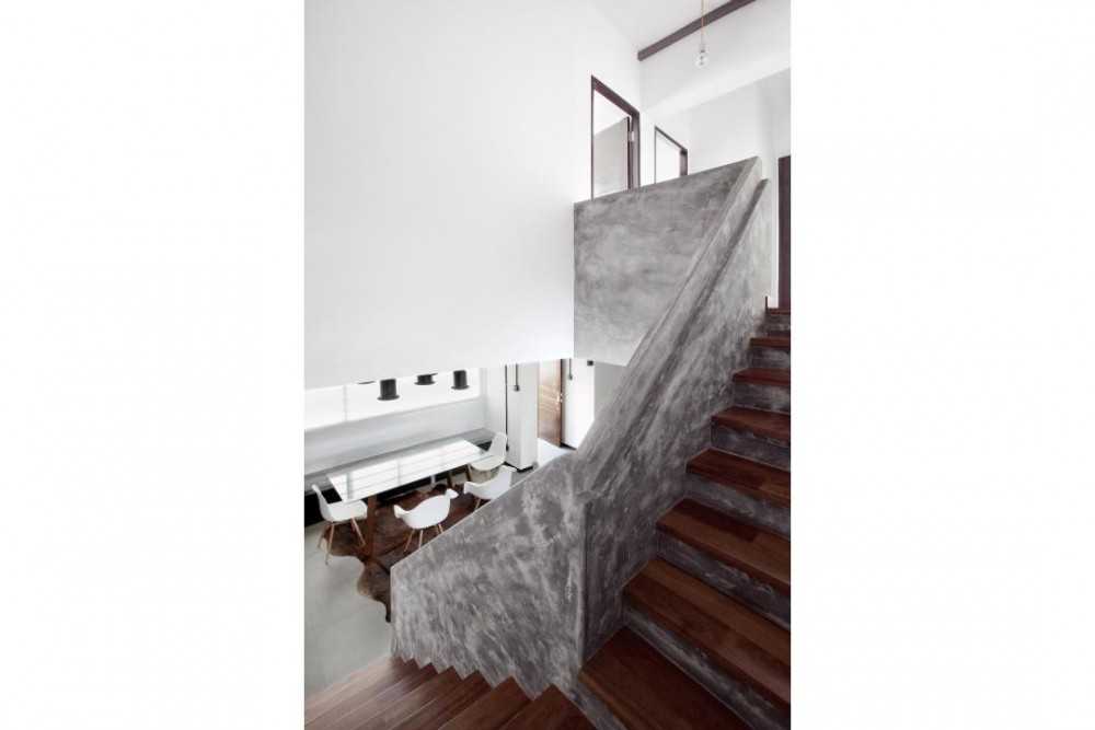 Industrial Hallway with Wood Flooring and Staircase
