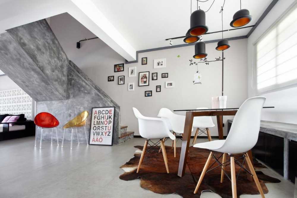 Industrial Dining Room with Drop Light and Dining Table