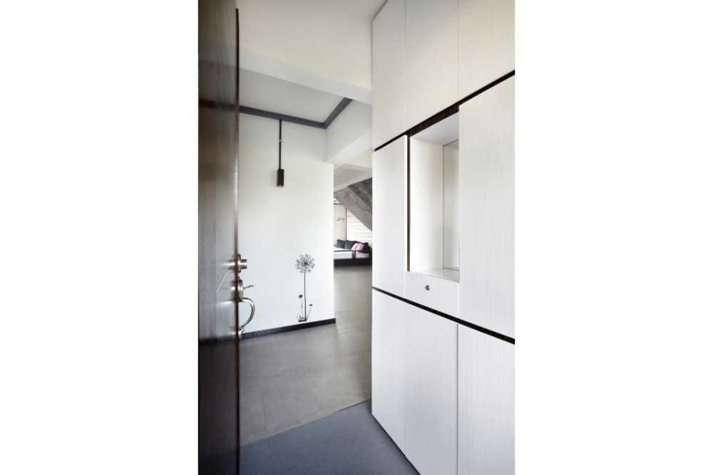 Industrial Hallway with Storage Cabinets and Doors