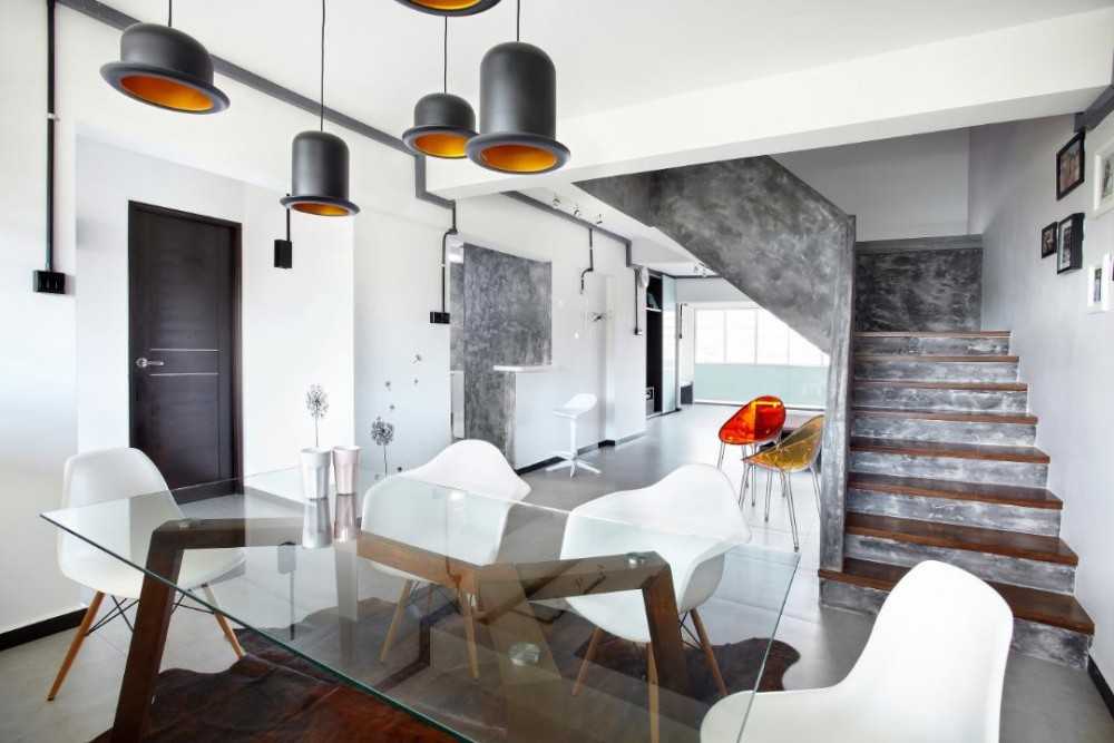 Industrial Dining Room with Drop Light and Dining Table