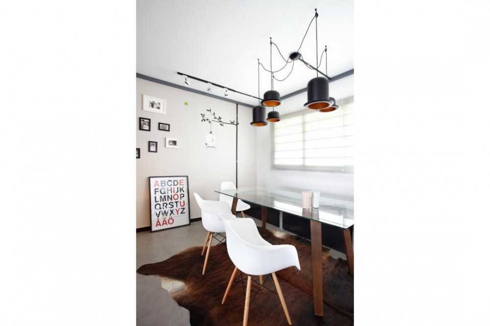 Industrial Dining Room with Drop Light and Dining Table