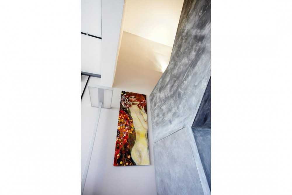 Industrial Hallway with Artwork and Paintings