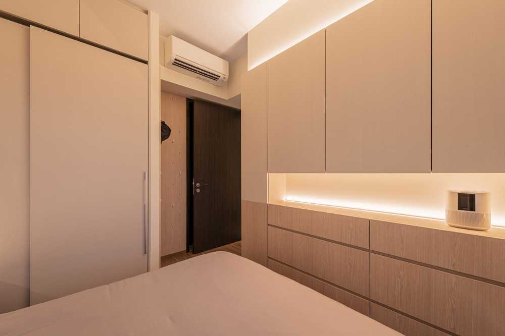 Minimalist Bedroom with Wood Flooring and Ceiling Light