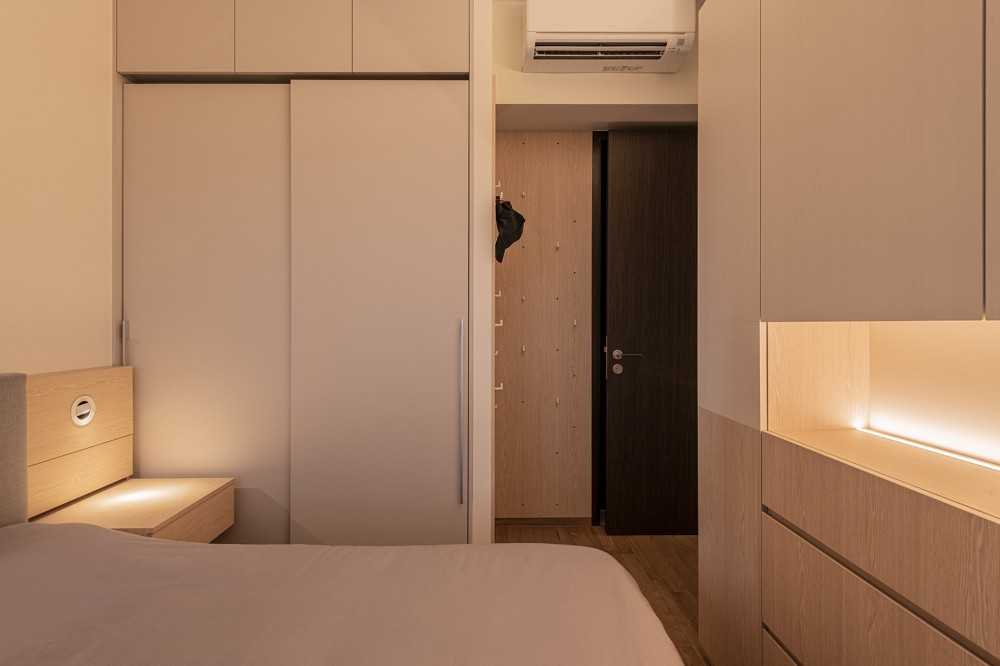 Minimalist Bedroom with Wood Flooring and Drop Ceiling