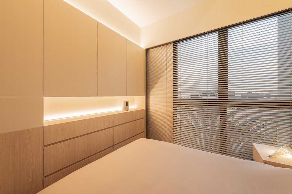 Minimalist Bedroom with Cement Floor and Bay Window