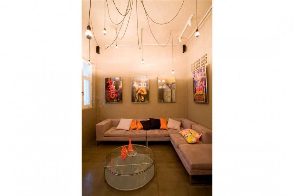 Eclectic Living Room with Drop Light and Sofa