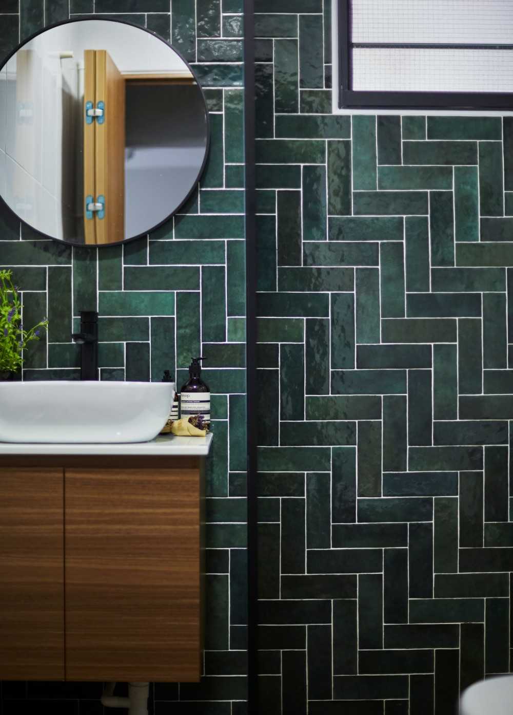 Modern Bathroom with Herringbone Tiling and Mirror