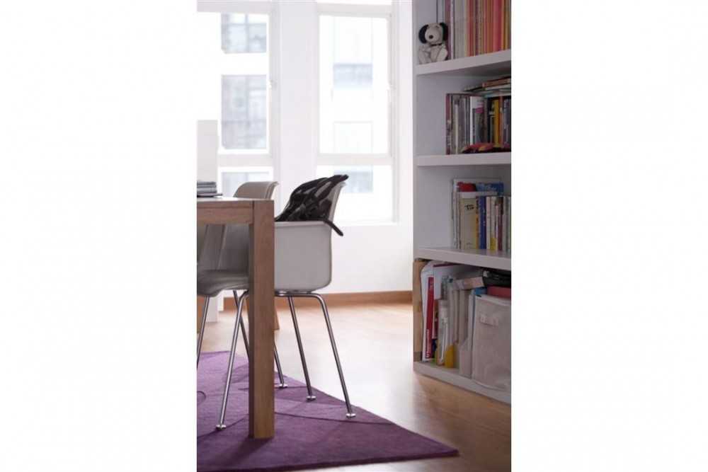 Eclectic Balcony with Bookshelf and Desk Chairs