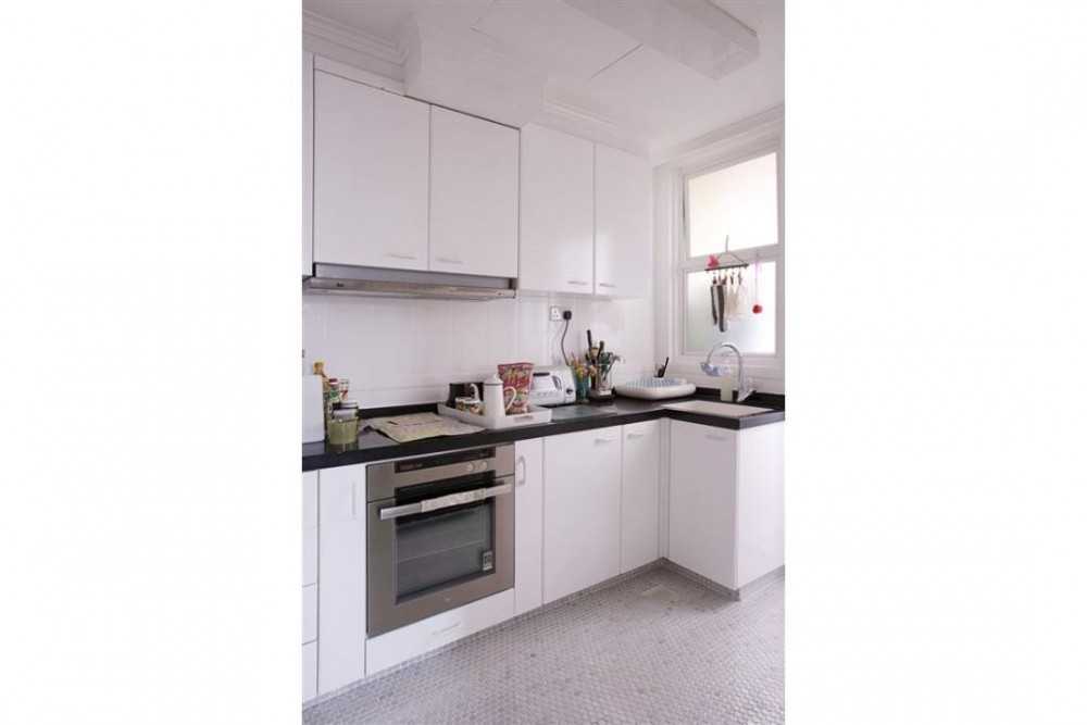 Eclectic Kitchen with Kitchen Cabinets and Oven