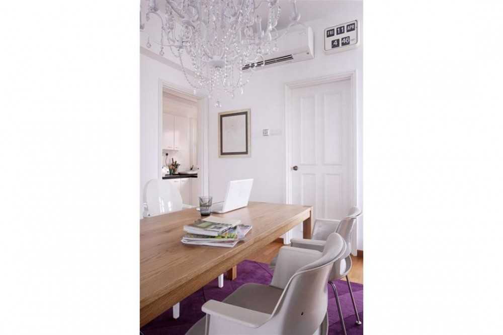 Eclectic Foyer with Chandelier and Dining Table