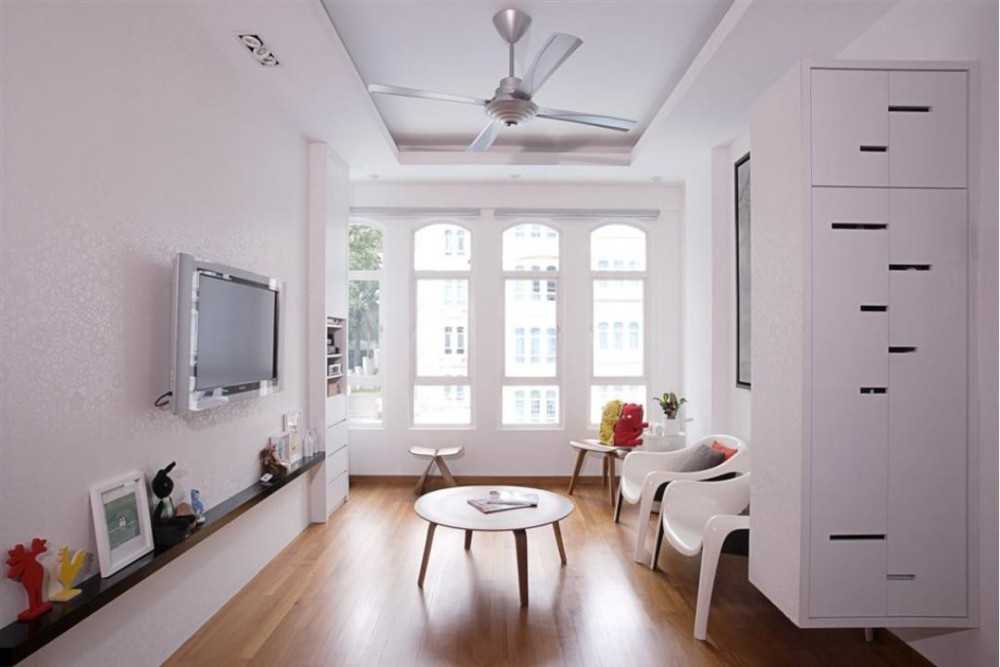Eclectic Living Room with Wood Flooring and Armchairs