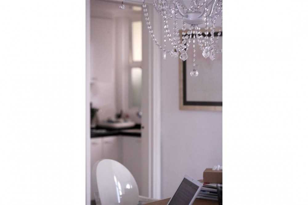 Eclectic Dining Room with Chandelier and Dining Table