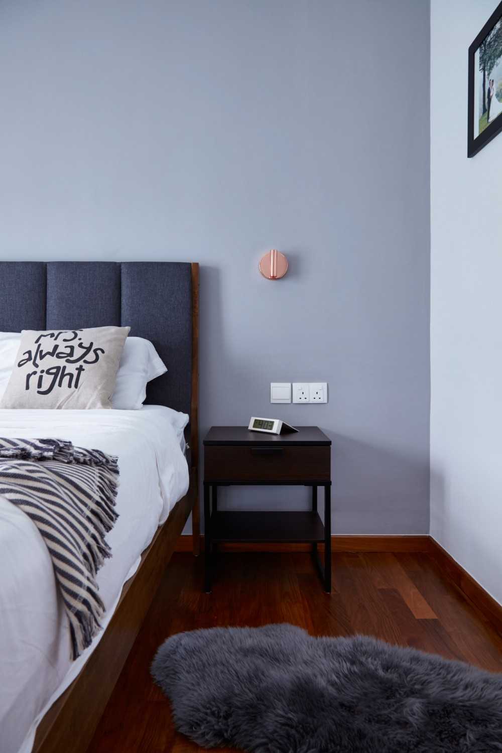 Modern Bedroom with Wood Flooring and Bedside Table