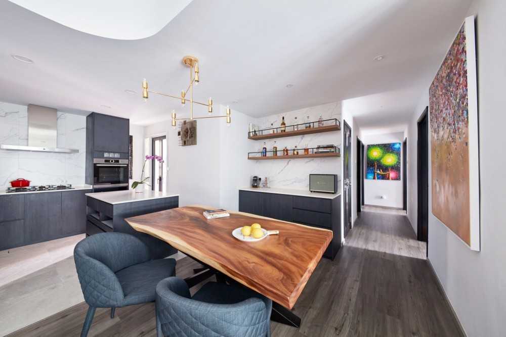 Modern Dining Room with Vinyl Flooring and Drop Light