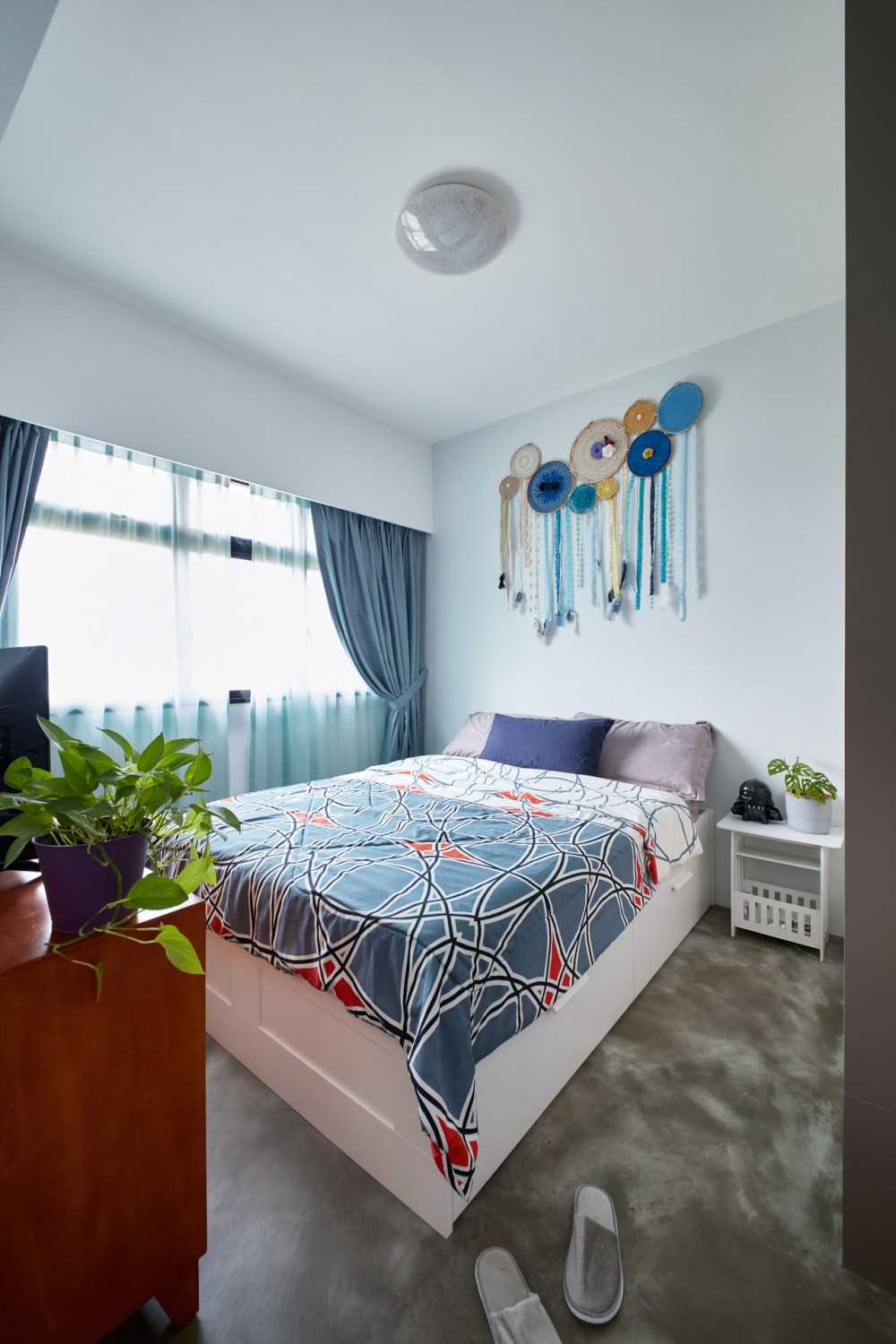 Eclectic Bedroom with Platform Bed and Cement Floor