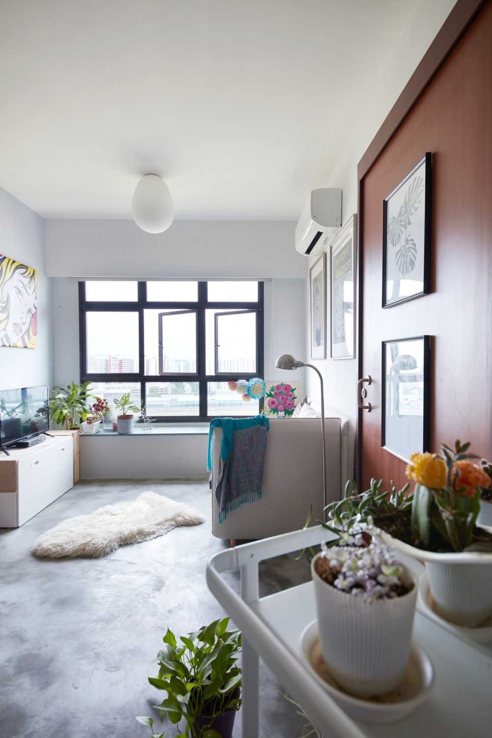 Eclectic Living Room with Cement Floor and Ceiling Light