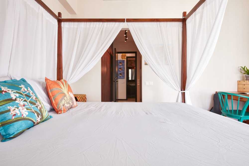 Country Bedroom with Armchairs and Queen Bed