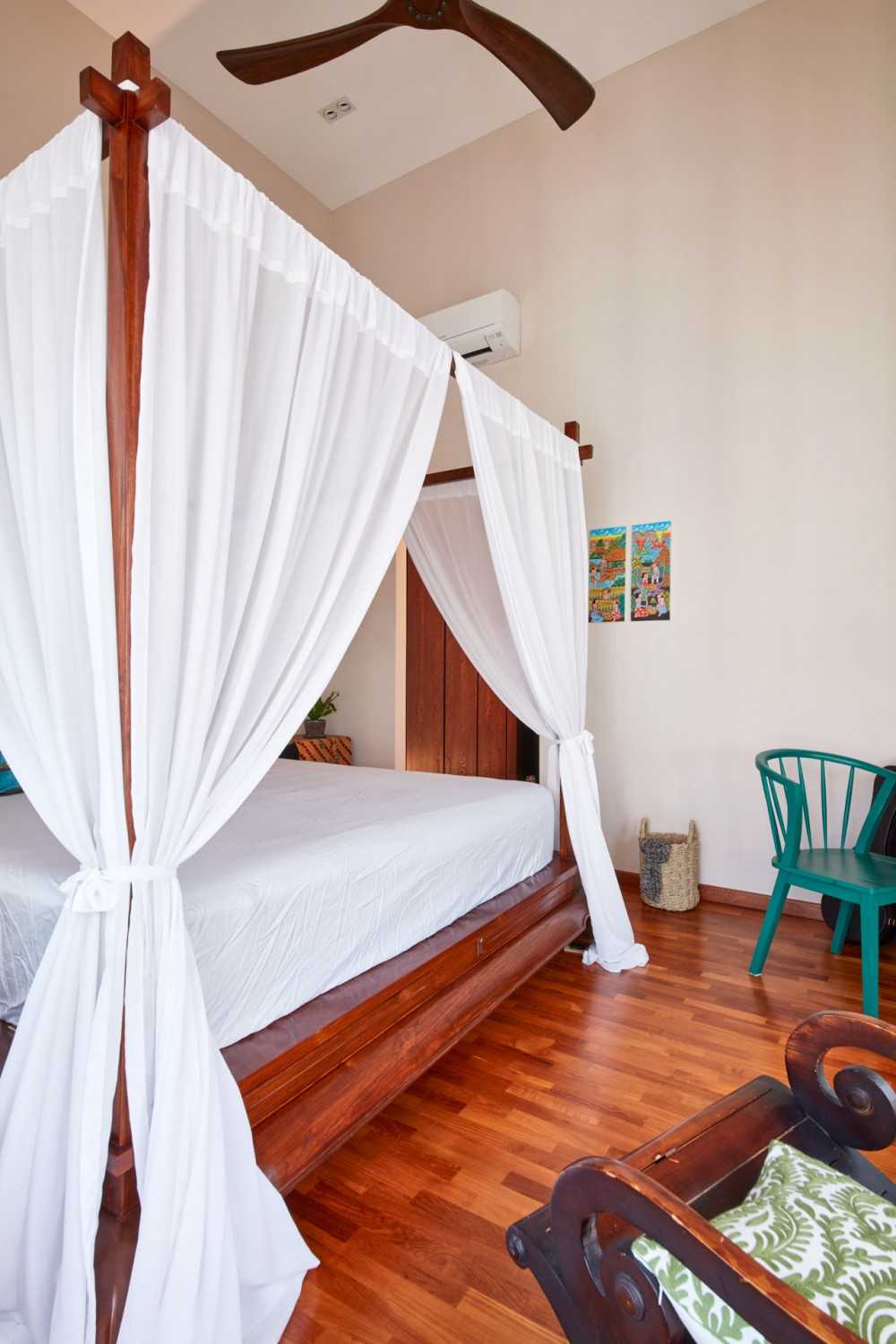 Country Bedroom with Wood Flooring and Ceiling Fan