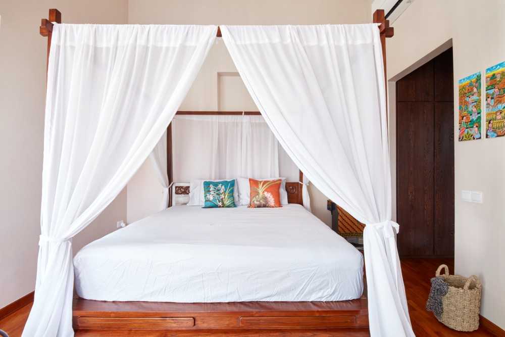 Country Bedroom with Platform Bed and Wood Flooring