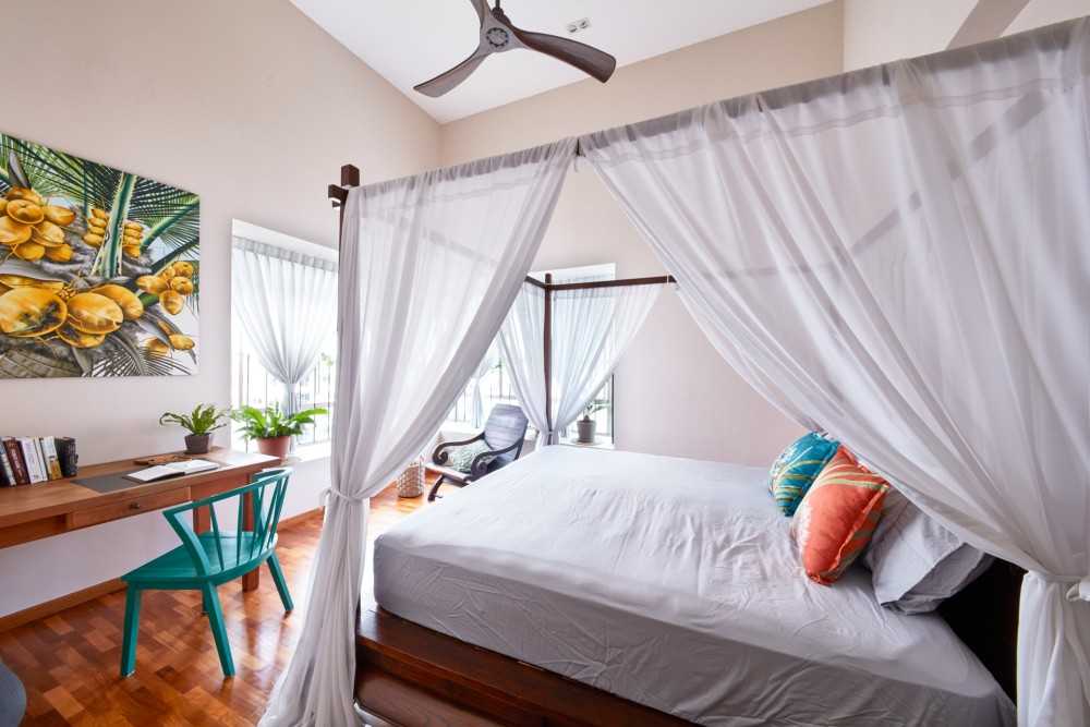 Country Bedroom with Wood Flooring and Ceiling Fan