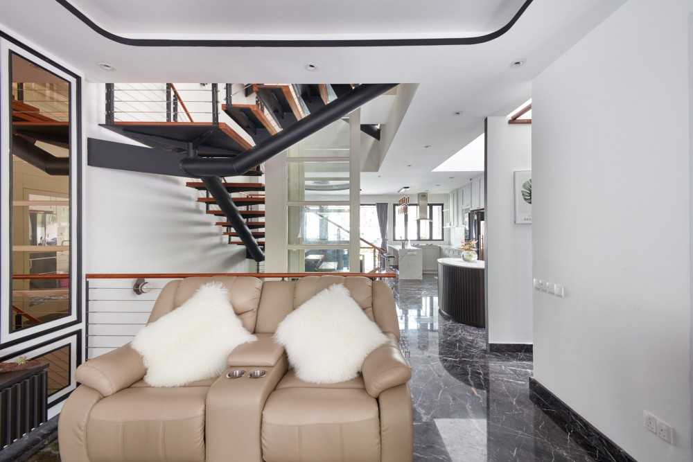 Modern Hallway with Staircase and Armchairs