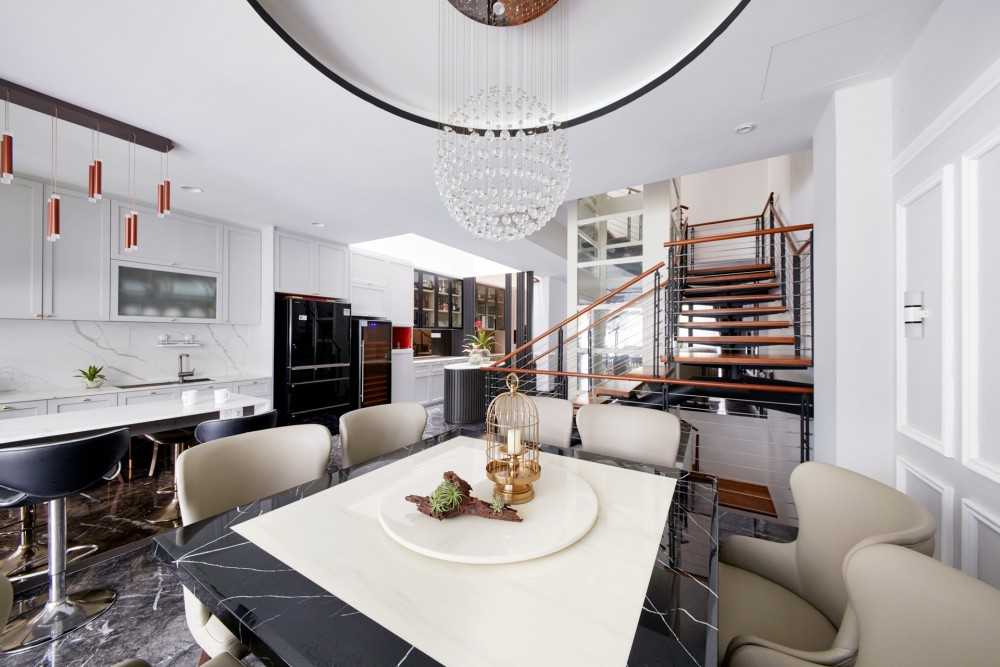 Modern Dining Room with Staircase and Chandelier