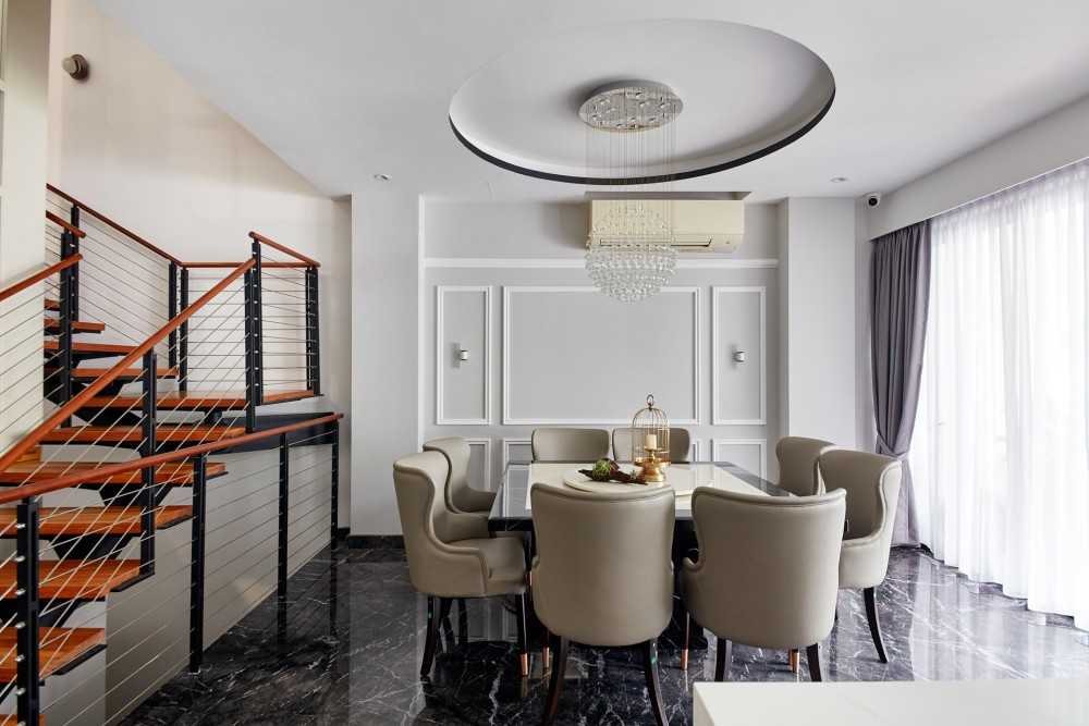 Modern Dining Room with Staircase and Chandelier