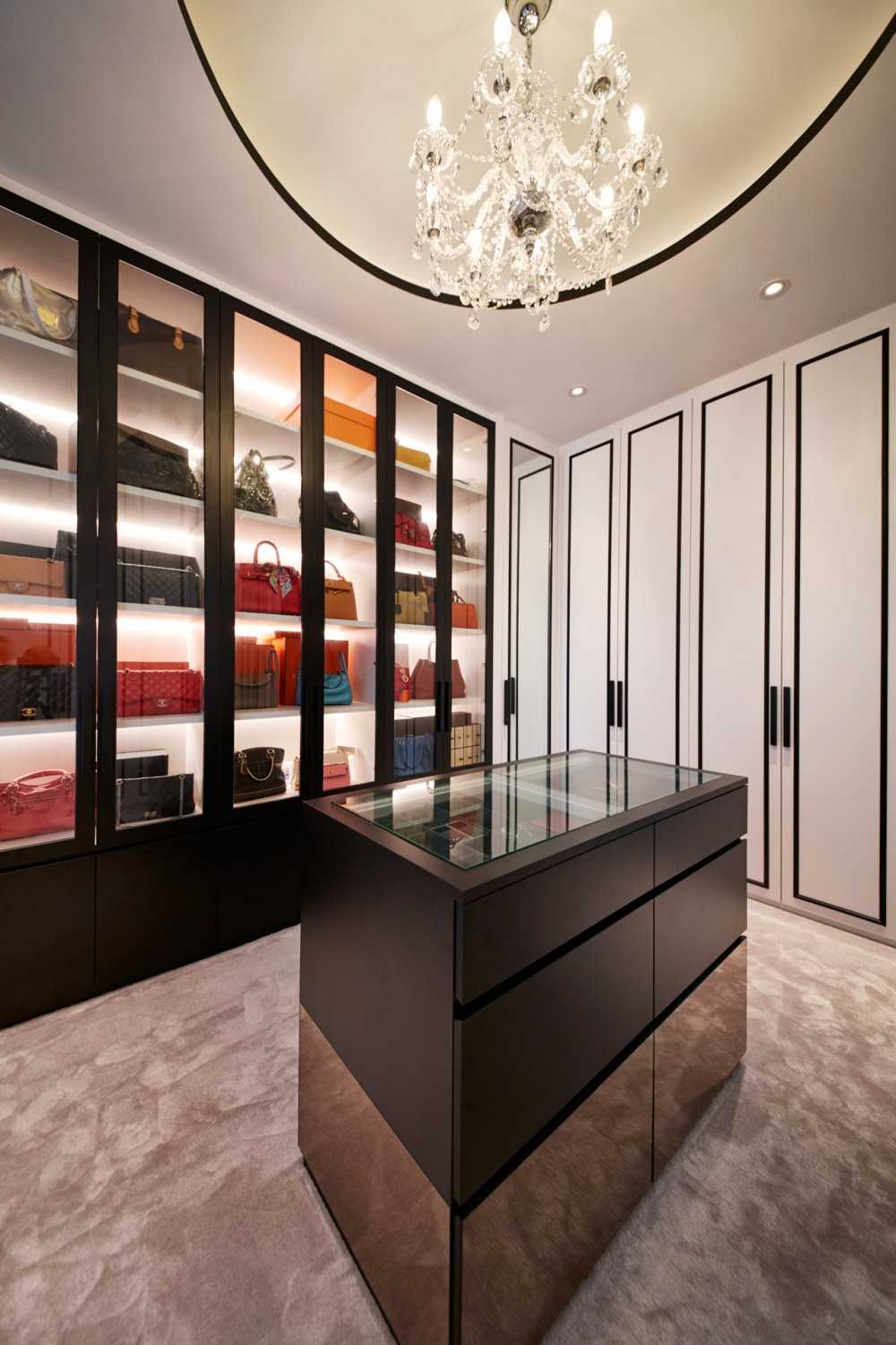 Modern Walk-in Wardrobe with Chandelier and Storage Cabinets