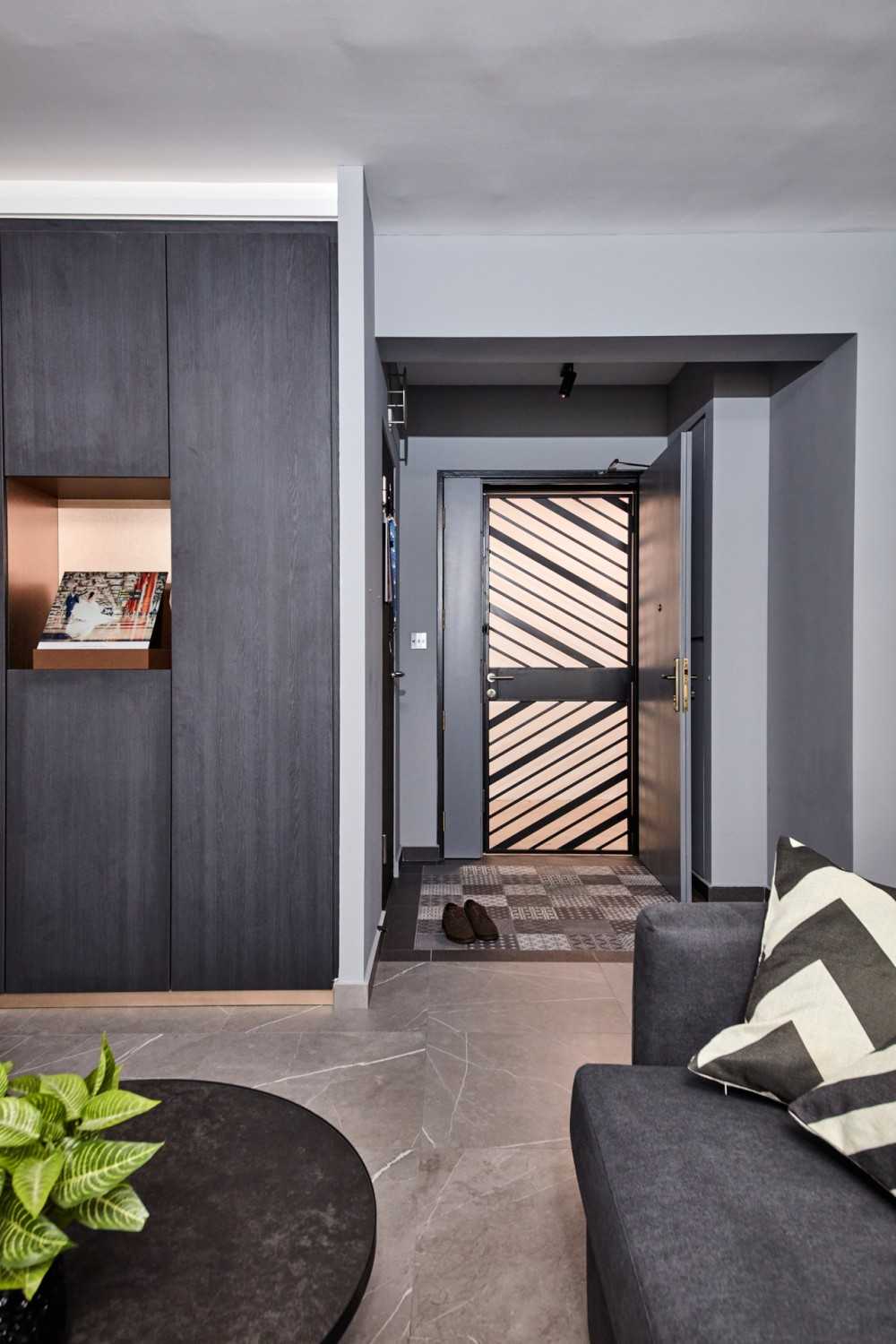 Modern Entryway with Granite Floor and Metal Gate