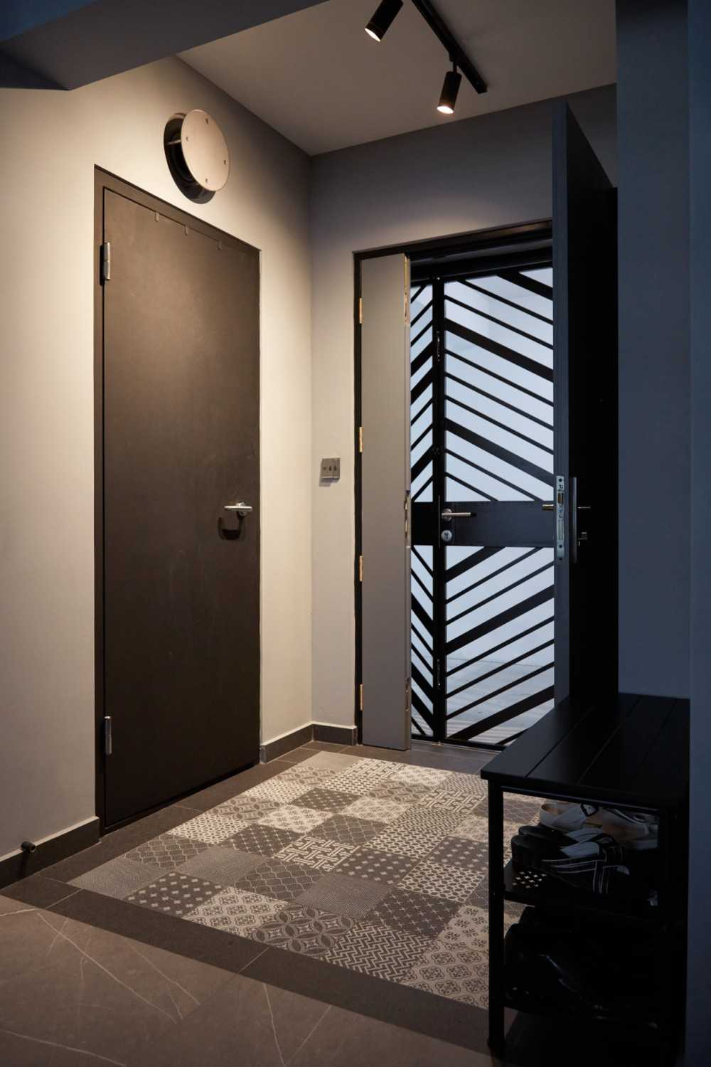 Modern Entryway with Herringbone Tiling and Metal Gate