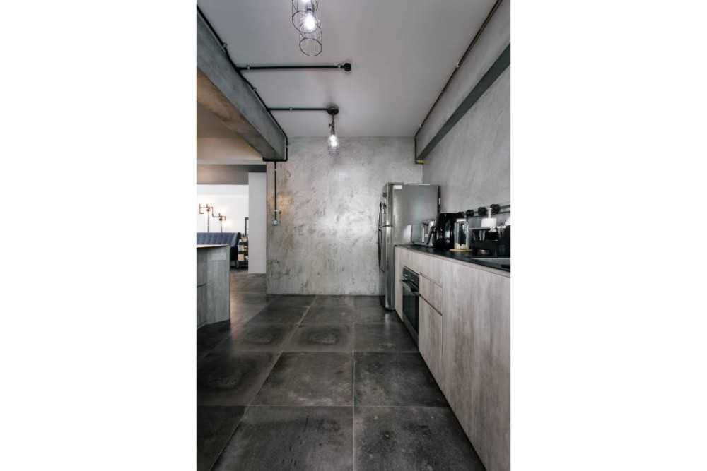 Industrial Kitchen with Cement Floor and Drop Light