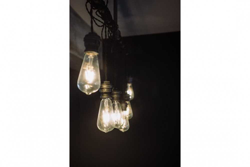 Industrial Living Room with Drop Light and Lighting