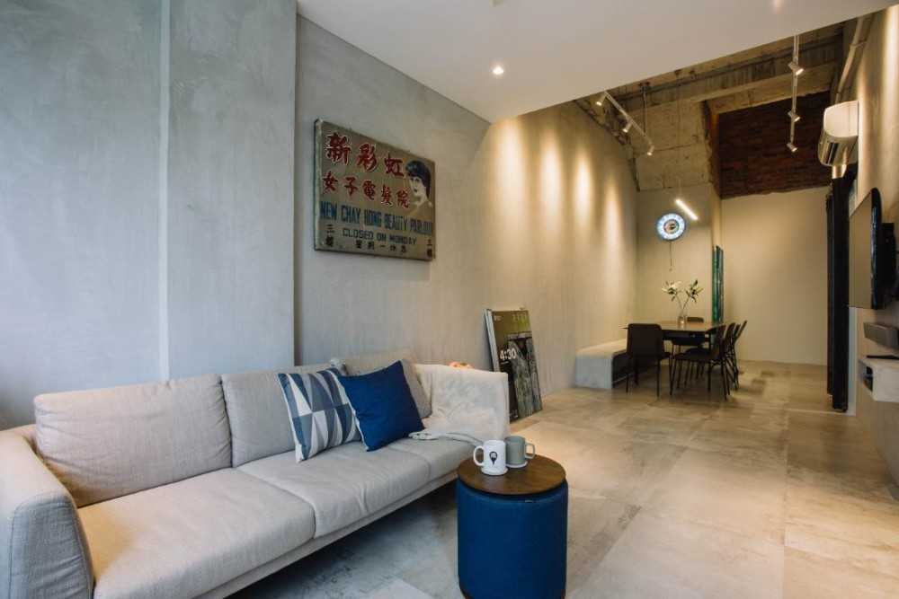 Minimalist Living Room with Cement Floor and Artwork