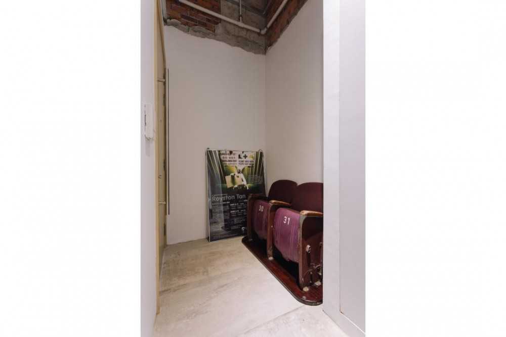 Minimalist Entryway with Artwork and Armchairs