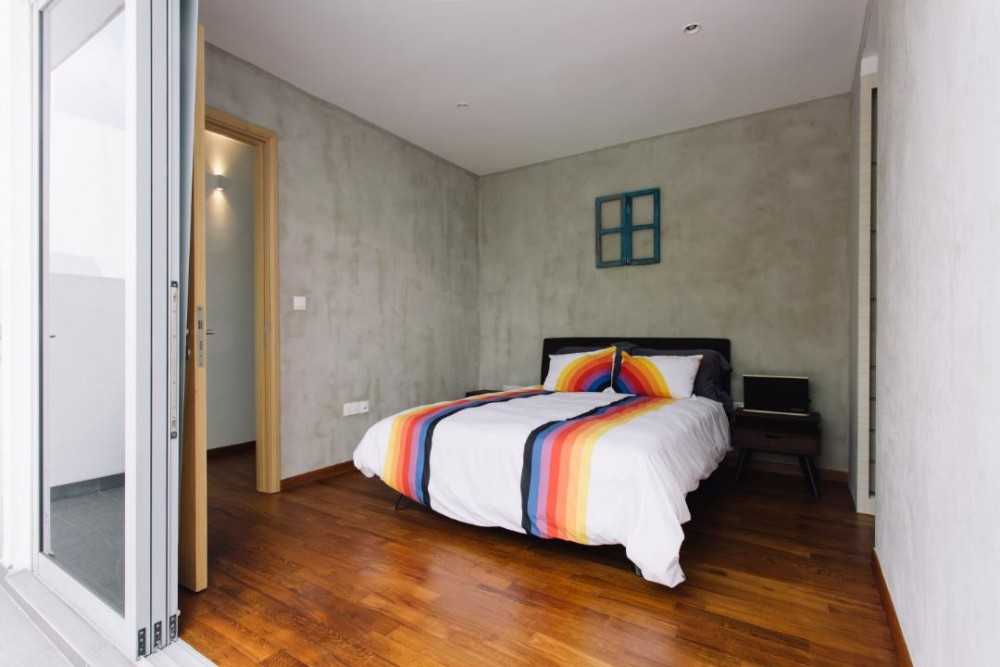 Minimalist Bedroom with Wood Flooring and Bedside Table