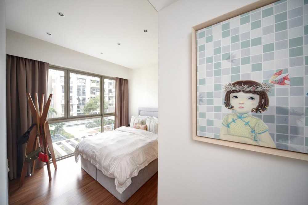 Eclectic Bedroom with Wood Flooring and Feature Wall