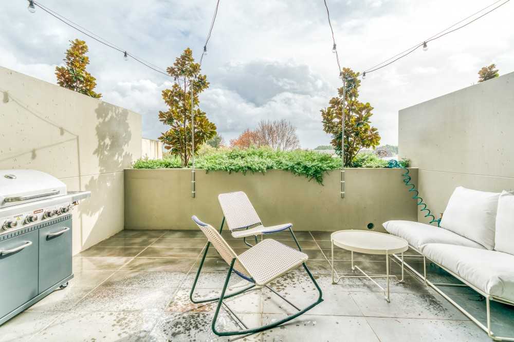 Eclectic Rooftop with Outdoor Chairs and Planters