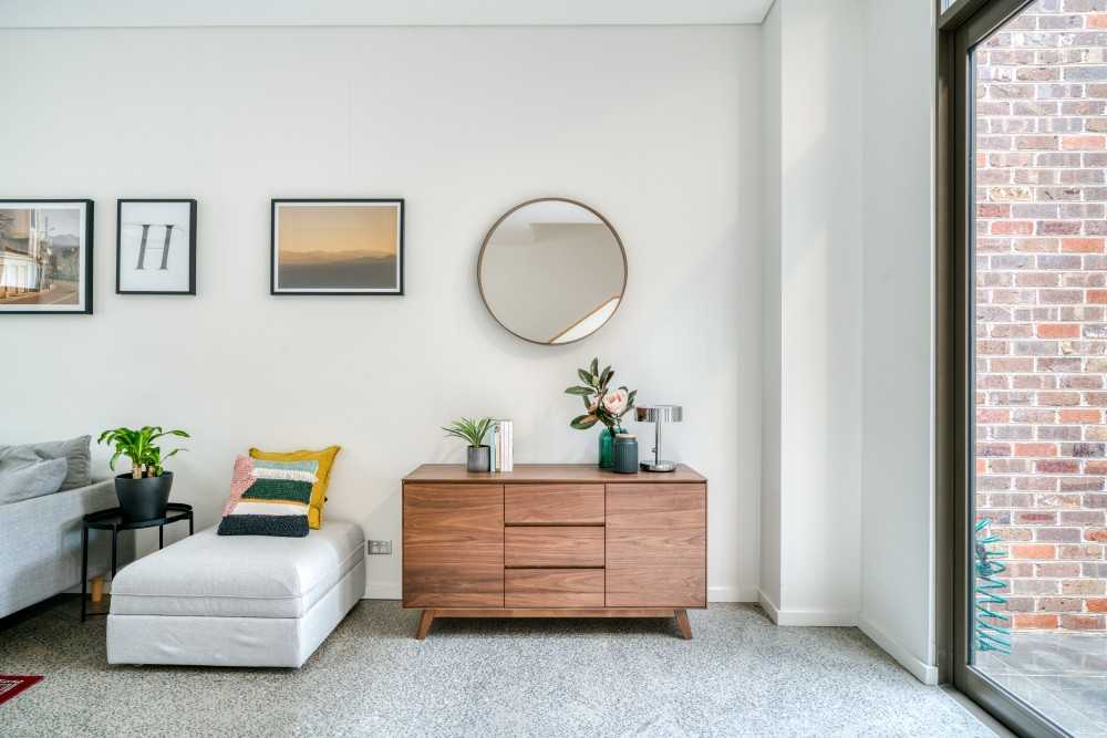 Eclectic Living Room with Mirror and Sideboard