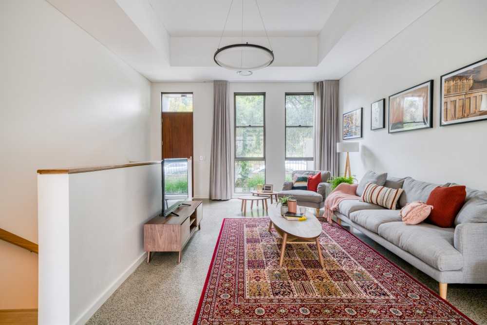 Eclectic Living Room with TV Console and Artwork