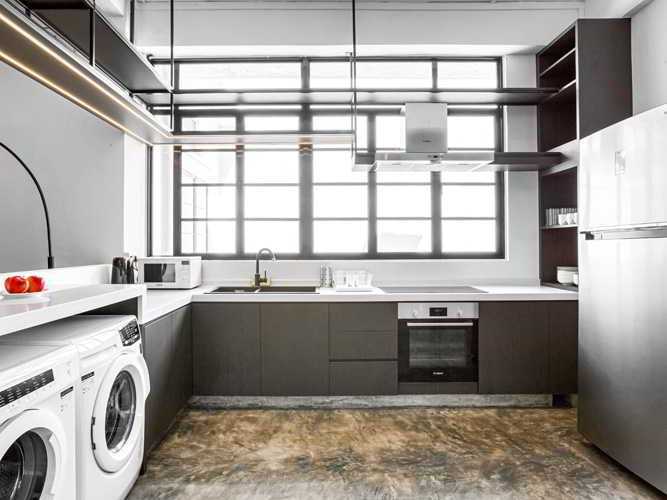 Modern Kitchen with Washing Machine and Kitchen Cabinets
