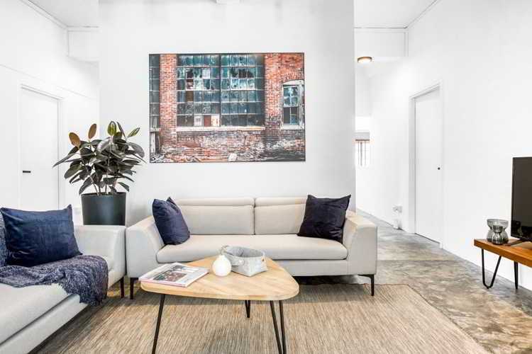 Modern Living Room with Sofa and Paintings