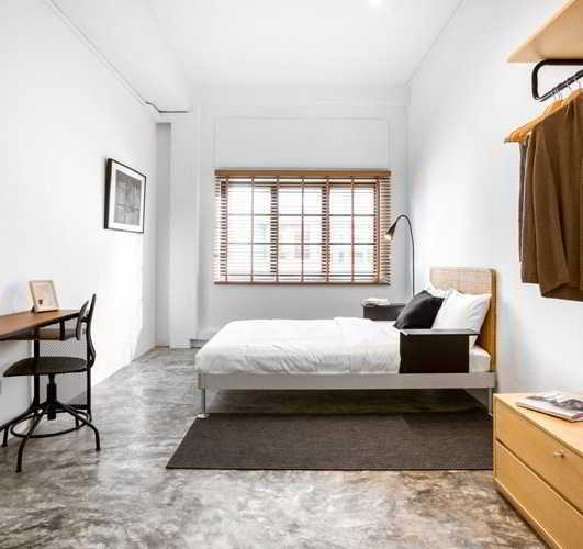 Modern Bedroom with Cement Floor and Desk
