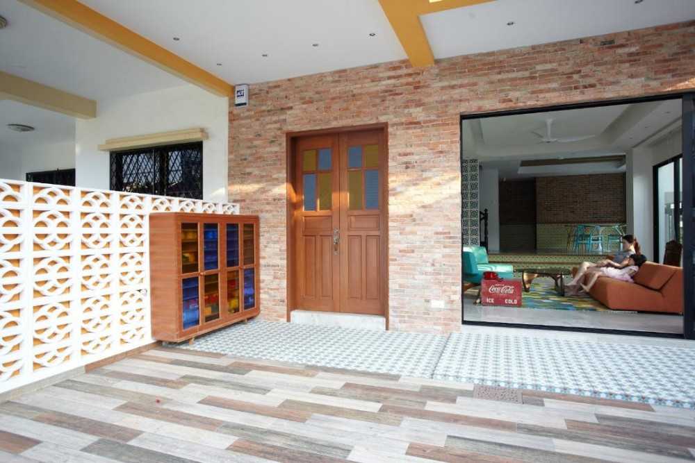 Eclectic Foyer with Feature Wall and Shoe Cabinets